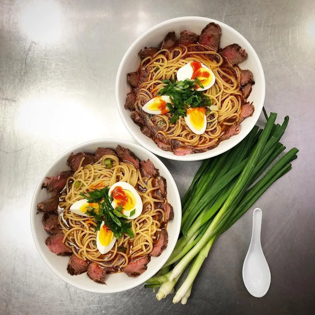 New dish introduced: Yakamein garnished with spring onions at Hand+Foot.