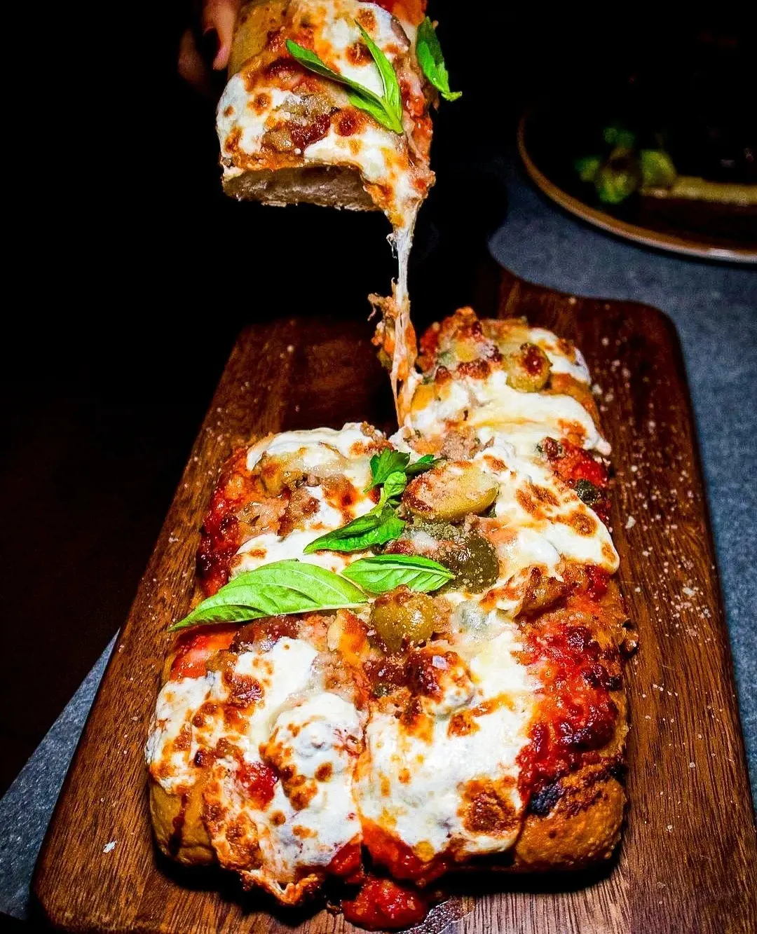 Delicious Italian Sausage Roman Pizza (photo by @nyc_cheatdayking)