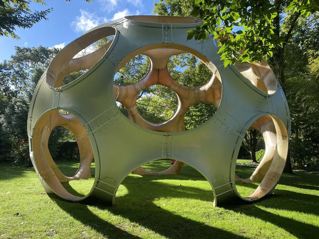 Sunny day at the Longhouse garden featuring an outdoor sculpture.